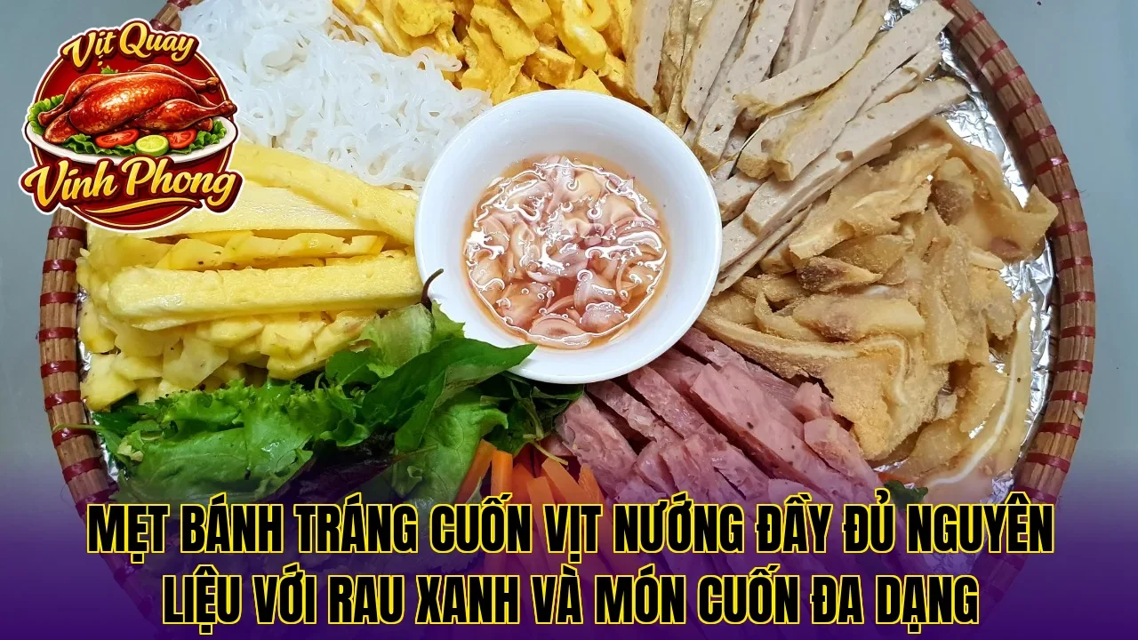 Mẹt bánh tráng cuốn vịt nướng đầy đủ nguyên liệu với rau xanh và món cuốn đa dạng